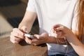 Couple listening to the music with earbuds from a smart phone Royalty Free Stock Photo