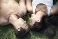 Couple Listening To Music While Lying On Grass Royalty Free Stock Photo