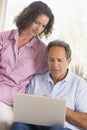 Couple in living room with laptop