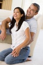 Couple in living room laughing