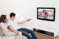 Couple in livingroom watching television Royalty Free Stock Photo