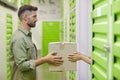 Couple Loading Boxes in Self Storage Unit Royalty Free Stock Photo