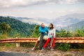 Couple with longboard and skateboard travel in tropcis of Asia Royalty Free Stock Photo