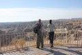 Couple looking at badlands canyon