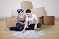 Couple looking at blueprint of new house Royalty Free Stock Photo