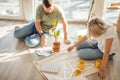 Couple looking blueprints of they new house. Planning interior design Royalty Free Stock Photo