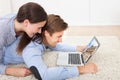 Couple looking at brandenburg gate on laptop at home