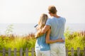 Couple looking into distance, shot from behind Royalty Free Stock Photo