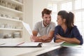 Couple Looking At Domestic Finances At Home Together Royalty Free Stock Photo