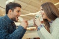 Couple looking at each other while eating fast food Royalty Free Stock Photo