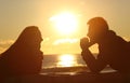 Couple looking each other at sunset Royalty Free Stock Photo