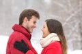 Couple looking each other in winter