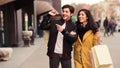 Couple looking at fashion store`s window, shopping together Royalty Free Stock Photo