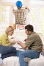 Couple looking at ground plan of new house Royalty Free Stock Photo