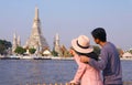 Couple Looking at the Iconic Stupa of Temple of Dawn or Wat Arun, a Famous Landmark Located on Chao Phraya River Bank, Bangkok