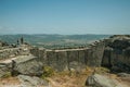 Couple looking the landscape from wall at the Castle of Monsanto