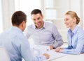 Couple looking at model of their house at office Royalty Free Stock Photo