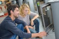 Couple looking at new woodburner Royalty Free Stock Photo