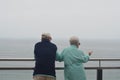 Couple looking the ocean in a pointview