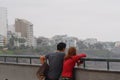 Couple looking the ocean in a pointview