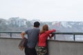 Couple looking the ocean in a pointview