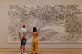 Couple looking at the painting in the museum