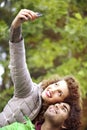 Couple looking up and smiling for a funny selfie