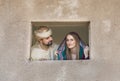 A couple looking at a window Royalty Free Stock Photo