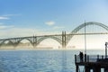 Couple looks a view of the Yaquina Bay Bridge