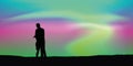 Couple in love on aurora borealis beautiful polar lights background