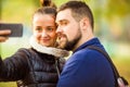 Couple in love in autumn makes selfie Royalty Free Stock Photo