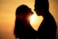 Couple in love back light silhouette on sea Royalty Free Stock Photo