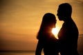 Couple in love back light silhouette on sea Royalty Free Stock Photo