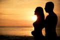 Couple in love back light silhouette on sea