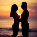 Couple in love back light silhouette on sea Royalty Free Stock Photo