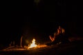 Couple in love on blurred background at campfire in forest