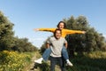 Couple in love. Boyfriend carrying his girlfriend on piggyback. Love and tenderness, dating, romance. Lifestyle concept Royalty Free Stock Photo