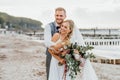 Couple in love. Bride and groom happily hugging on the beach. just married Royalty Free Stock Photo