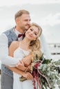 Couple in love. Bride and groom happily hugging on the beach. just married Royalty Free Stock Photo