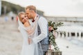 Couple in love. Bride and groom kiss and hug on the beach Royalty Free Stock Photo