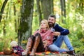 Couple in love celebrate anniversary picnic date. Couple cuddling drinking wine. Enjoying their perfect date. Happy Royalty Free Stock Photo