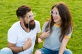 Couple in love cheerful youth booth props. Man bearded hipster and pretty woman cheerful faces. Youth day. Summer