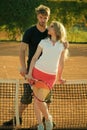 Couple in love. Couple in love stand at tennis net on clay court Royalty Free Stock Photo