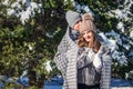 Couple in love covered with blanket hugs in winter forest Royalty Free Stock Photo