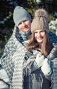 Couple in love covered with blanket hugs in winter forest Royalty Free Stock Photo