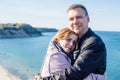 Couple in love cuddling on a seaside