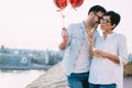 Couple in love holding red baloons hearts on valentine day Royalty Free Stock Photo