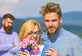 Couple in love dating while jealous bearded man watching wife cheating him with lover. Infidelity concept. Couple Royalty Free Stock Photo