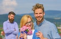 Couple in love dating while jealous bearded man watching wife cheating him with lover. Lovers hugs outdoor flirt romance Royalty Free Stock Photo