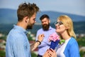 Couple in love dating while jealous husband fixedly watching on background. Unrequited love concept. Couple romantic Royalty Free Stock Photo